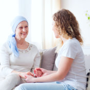 two women sitting on a couch