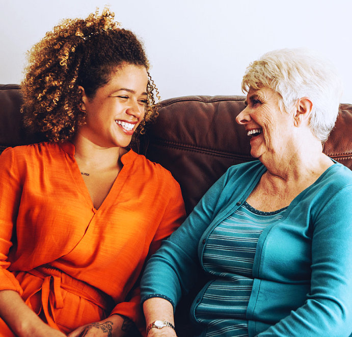 two women smiling to each other