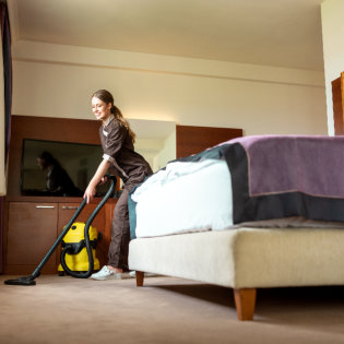 caregiver cleaning the room