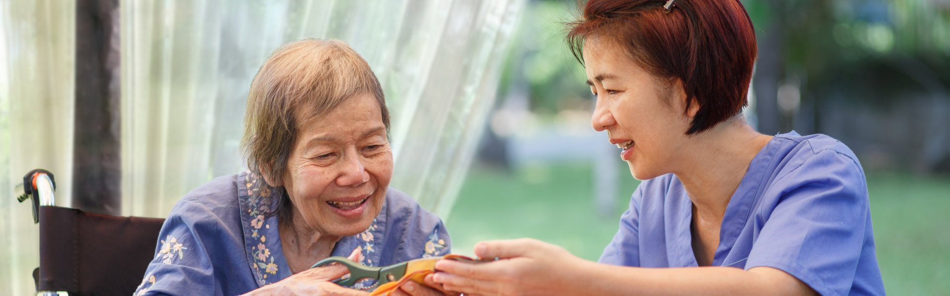 Elderly woman with caregiver